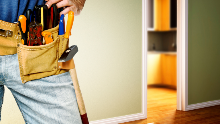handyman with toolbelt renovating your space